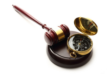 Judge's wooden gavel and compass