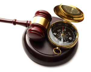 Judge's wooden gavel and compass