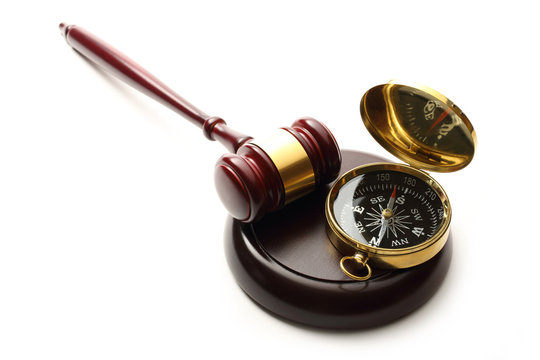 Judge's wooden gavel and compass - Powered by Adobe