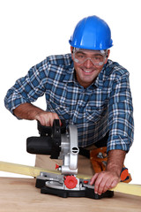 craftsman working with an electric saw