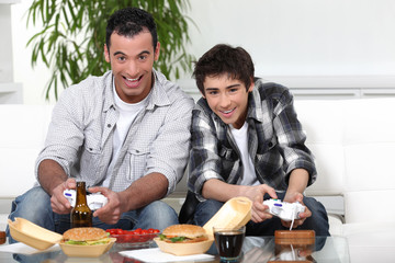 Father and son playing games together