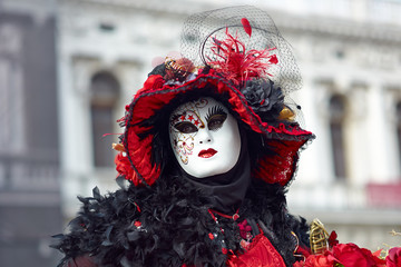 Venetian costume attends Carnival of Venice.