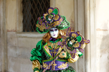 Venetian costume attends Carnival of Venice.