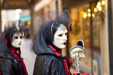 Venetian costume attends Carnival of Venice.