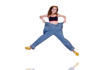 Woman in dieting concept with big jeans