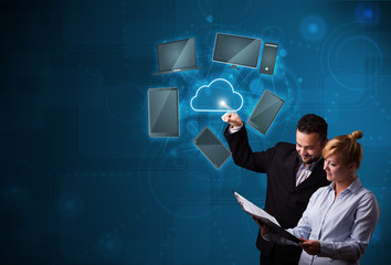 Happy couple touching cloud service