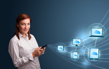 Pretty lady typing on smartphone with cloud computing