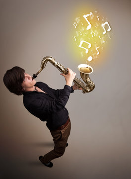 Handsome musician playing on saxophone with musical notes