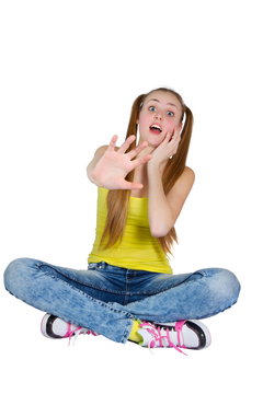 picture of a girl in a yellow T-shirt and blue jeans