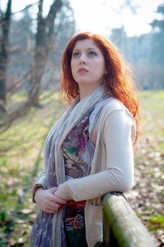 beautiful young woman posing in the park