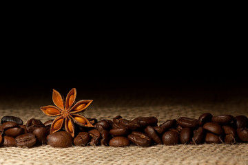 Coffee and Star Anise on sackcloth background with copyspace