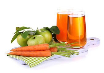 Glasses of juice, apples and carrots, isolated on white