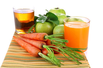Glasses of juice, apples and carrots, isolated on white