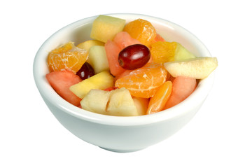 Fresh fruit salad in a bowl on a white background.