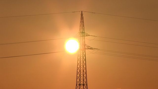 Sunset with electrical pylon (time lapse)