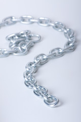 Fototapeta premium metal links of chain on a white background