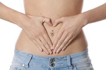 Fototapeta premium Model Released. Healthy Fit Young Woman Heart Shape on Tummy