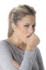 Model Released. Young Woman Biting Thumb