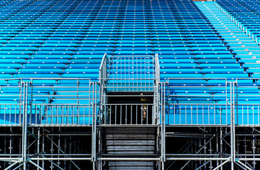 Empty blue seats on a tribune