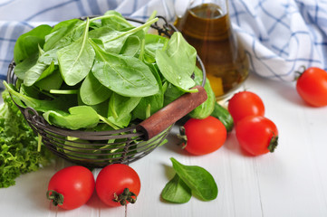 Fresh spinach leaves in basket
