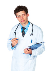 Fototapeta premium Young male doctor writing on a patient's medical chart