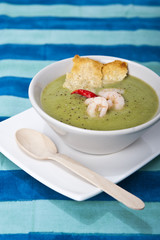 Bowl of shrimp and zucchini Soup with crostini