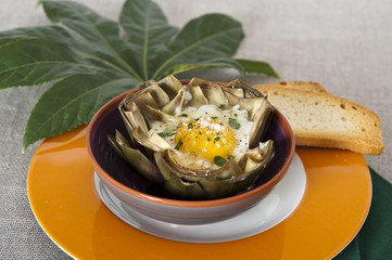 artichoke with egg in a bowl