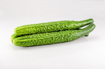 Three cucumbers on the white background