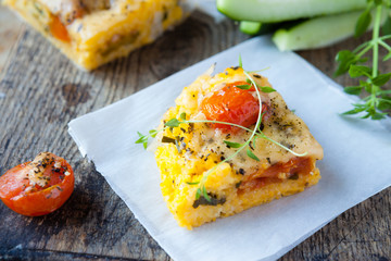 piece of polenta with cheese on the board