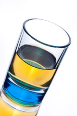 Close up of shot alcohol drink on white background