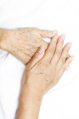 woman hand putting on her mother hand