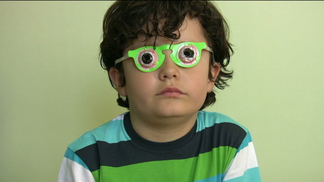 Little boy with funny glasses