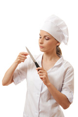 Woman cook holding a kitchen knife, isolated on white background