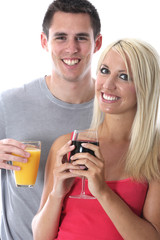 Model Released. Young Couple Drinking