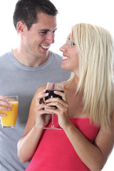 Model Released. Young Couple Drinking