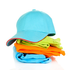 Blue peaked cap with T-shirts isolated on white