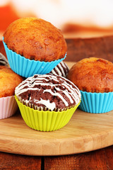 Sweet cupcakes on wooden table