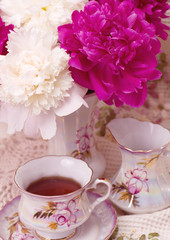 Fototapeta na wymiar Vintage teacup with spring pi-mesons