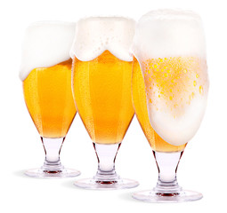 Frosty glass of light beer set isolated