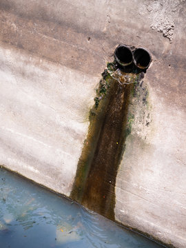 industrial sewage dumpng dirty water into canal