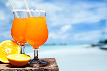 Tequila Sunrise Cocktail on wooden planks