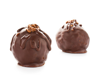 Two delicious liqueur dark chocolate candies isolated on a white