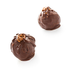 Two delicious  dark chocolate candies isolated on a white backgr