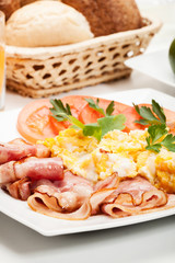 Scrambled eggs with bacon. Selective focus.