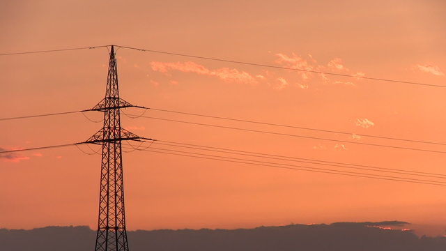 Sunset with electrical pylon (time lapse)