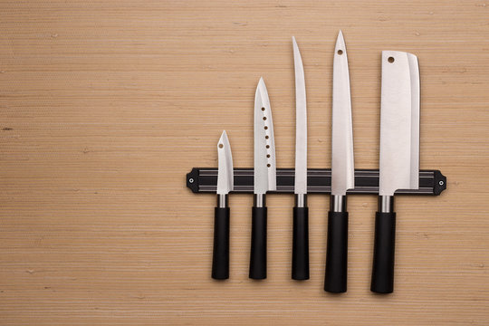 Set of knives on a magnetic holder