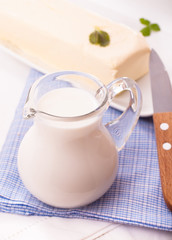 Obraz na płótnie Canvas Milk jug and butter