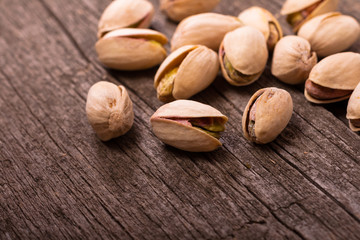 Pistachios on wooden surface