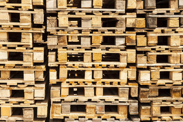 Wooden transport euro pallets in stacks.