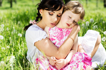 Little girl and mother in the park